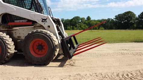 bale spear skid steer attachment|round bale hay fork attachment.